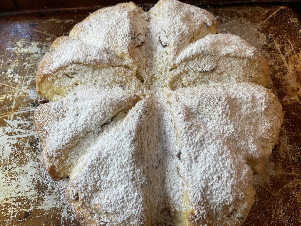 Baked scones with powdered sugar topping