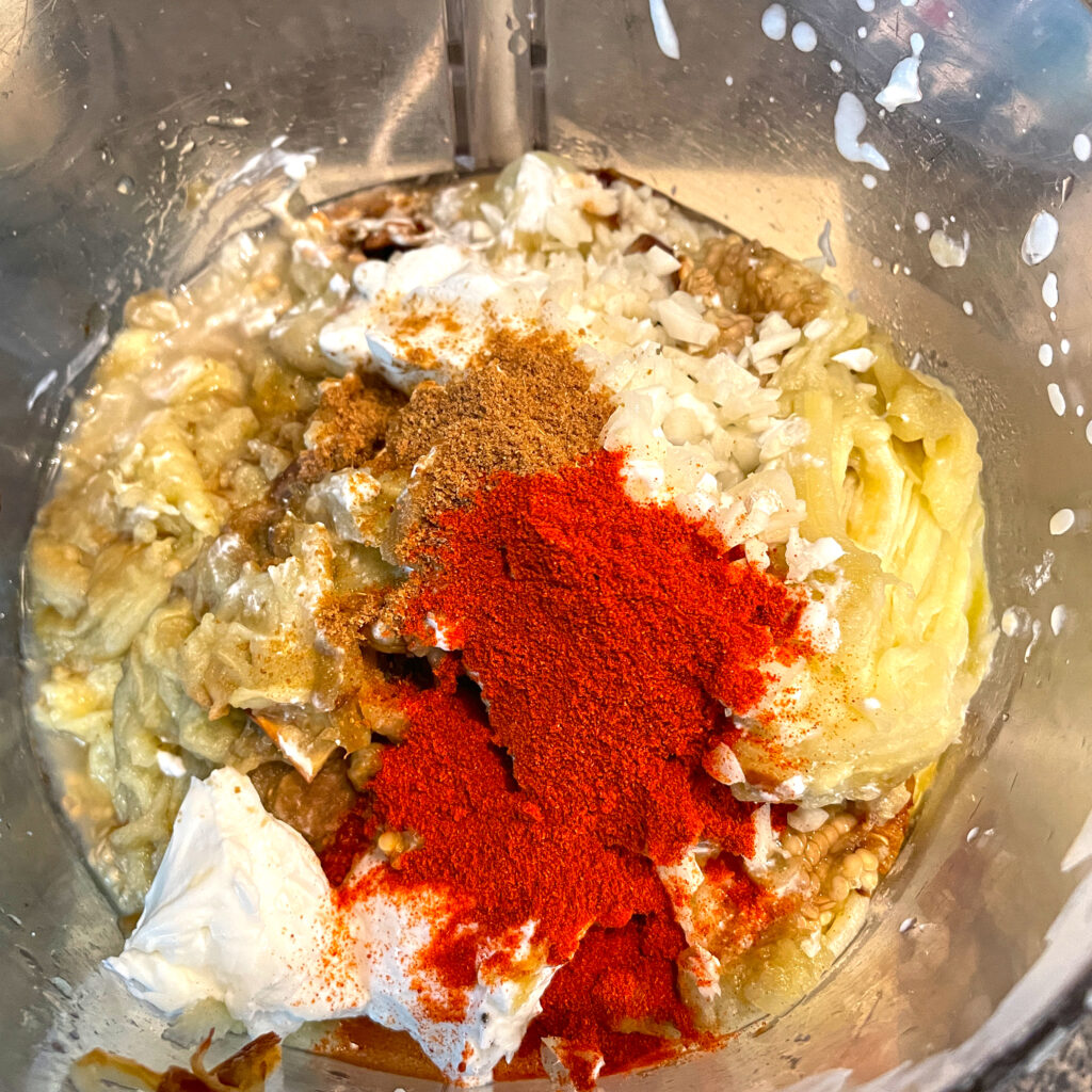 All ingredients in bowl of food processor before blending