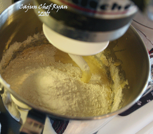 Add 3 cups flour 1 cup at a time, mix with dough hook