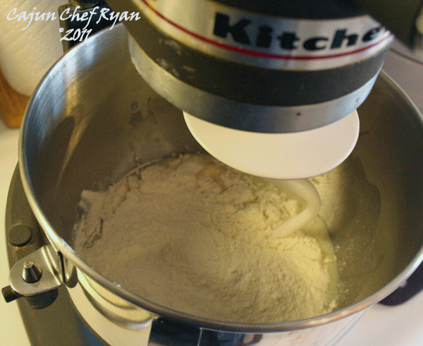 Add 2 cups flour, mix with dough hook