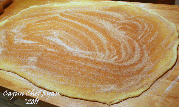 Cinnamon sugar sprinkled on dough