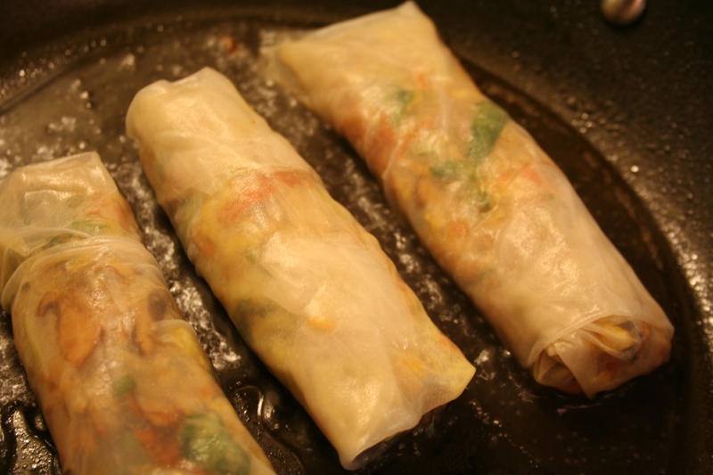Pan steaming the spring rolls