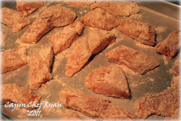 Floured catfish strips resting on wax paper at least 5 minutes
