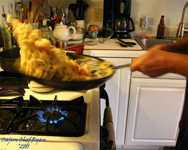 Flipping the pasta in the skillet