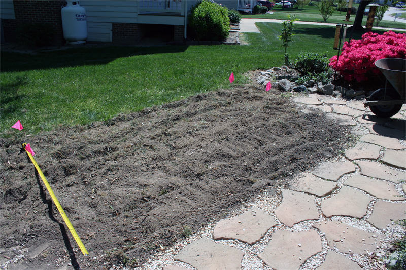 Marking out the garden plots and paver paths