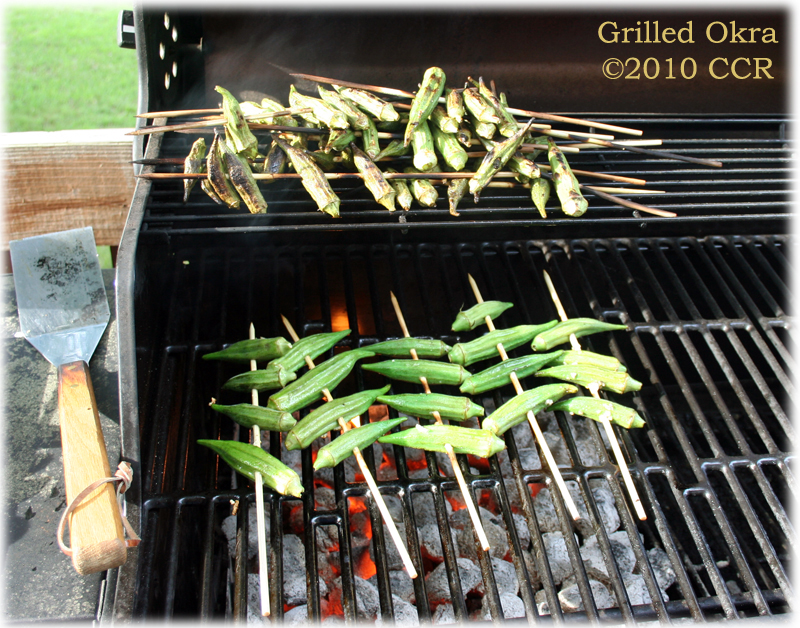 Grilling Okra on the coals, a few done at the top