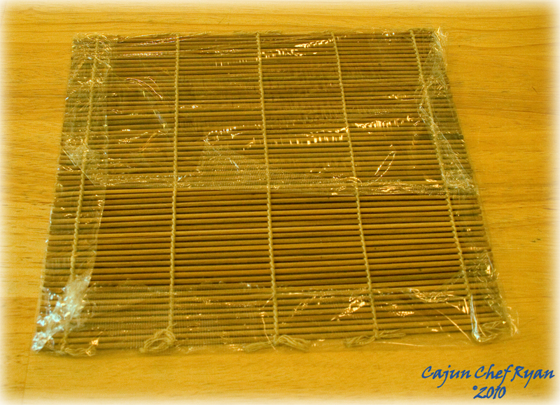 Folded plastic wrap over bamboo mat