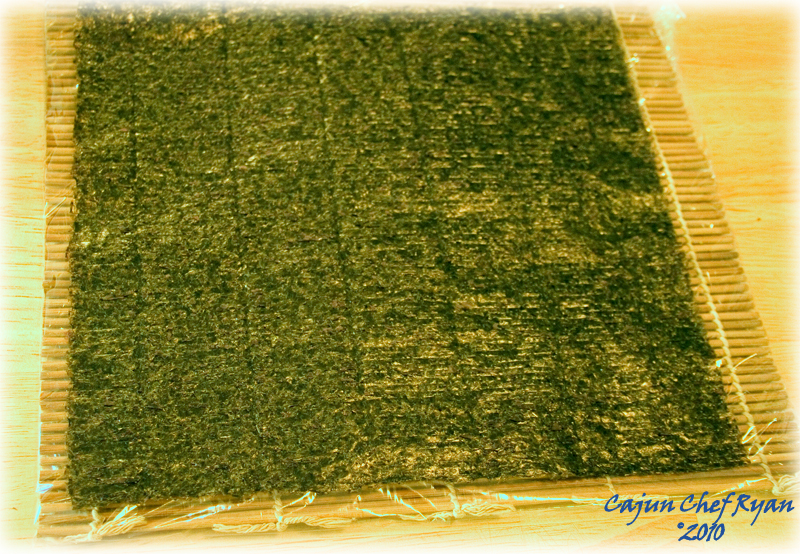 Nori sheet on plastic covered bamboo mat