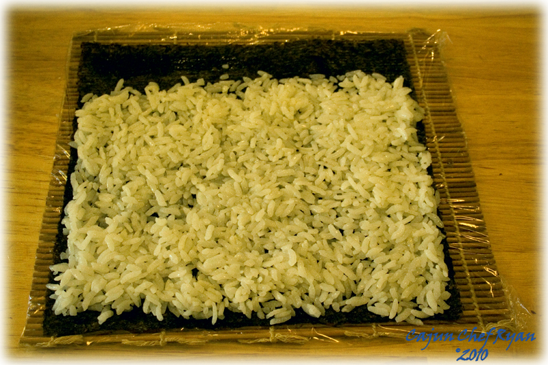 3/4 cup of prepared sushi rice on the nori