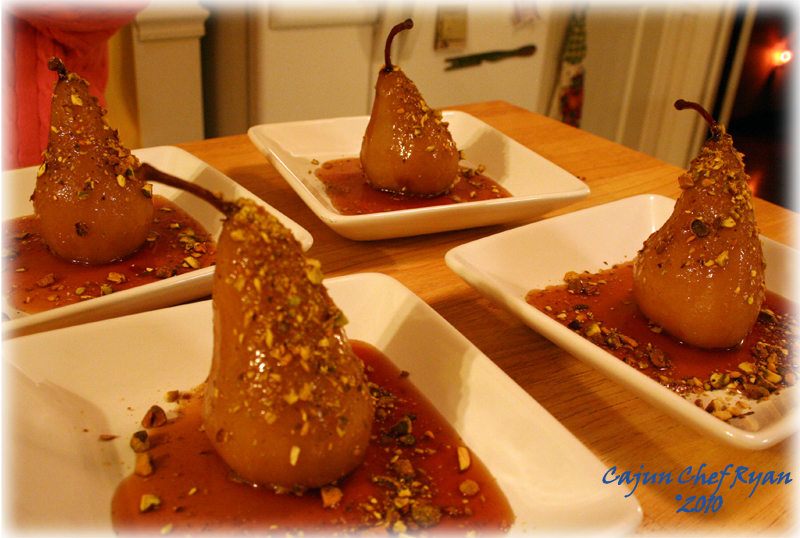 Four of the poached pears ready to serve