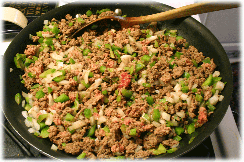 Browning the beef, onions, and peppers