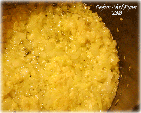 First you start with heating the butter and olive oil over medium-high heat and then sauté the onions and garlic until soft and translucent.